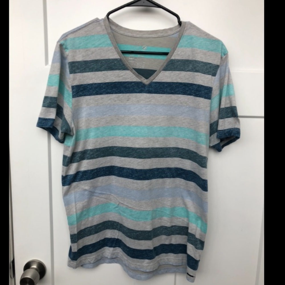 On The Byas Grey T-shirt with stripes in various shades of blue.